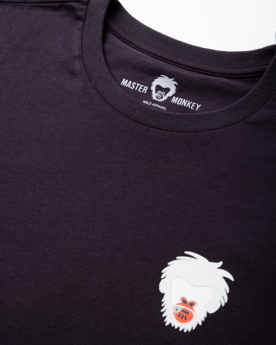 Purple t-shirt with a white master monkey logo on a white background #color_lead