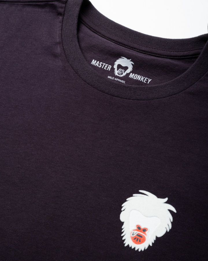 Purple t-shirt with a white master monkey logo on a white background #color_lead