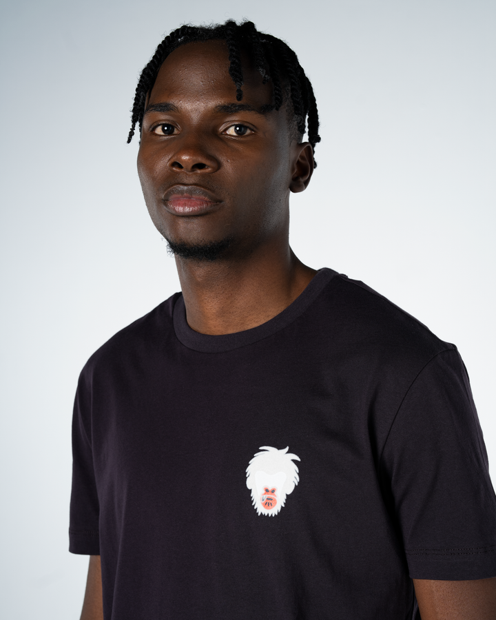 Person wearing a lead t-shirt with a white graphic design on a light gray background #color_lead