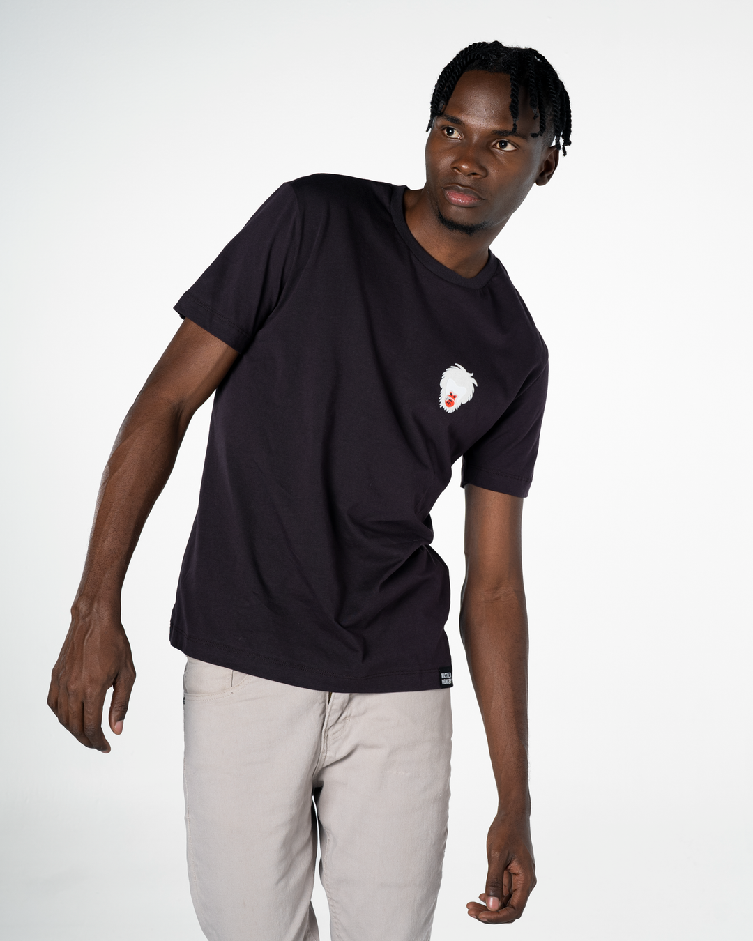 Person wearing a black t-shirt with a Master Monkey logo on a white background #color_black