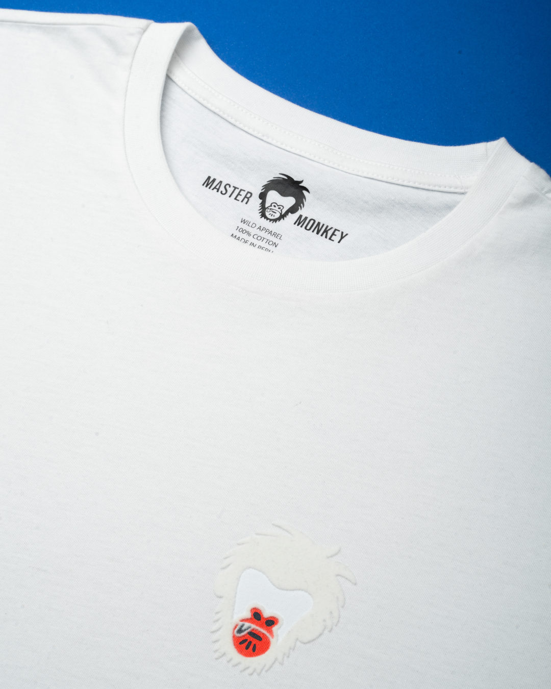 White t-shirt with a Master Monkey logo on a blue background #color_white