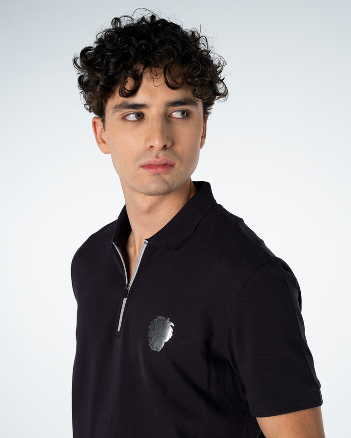 Man wearing a purple polo shirt with a logo on a white background #color_lead