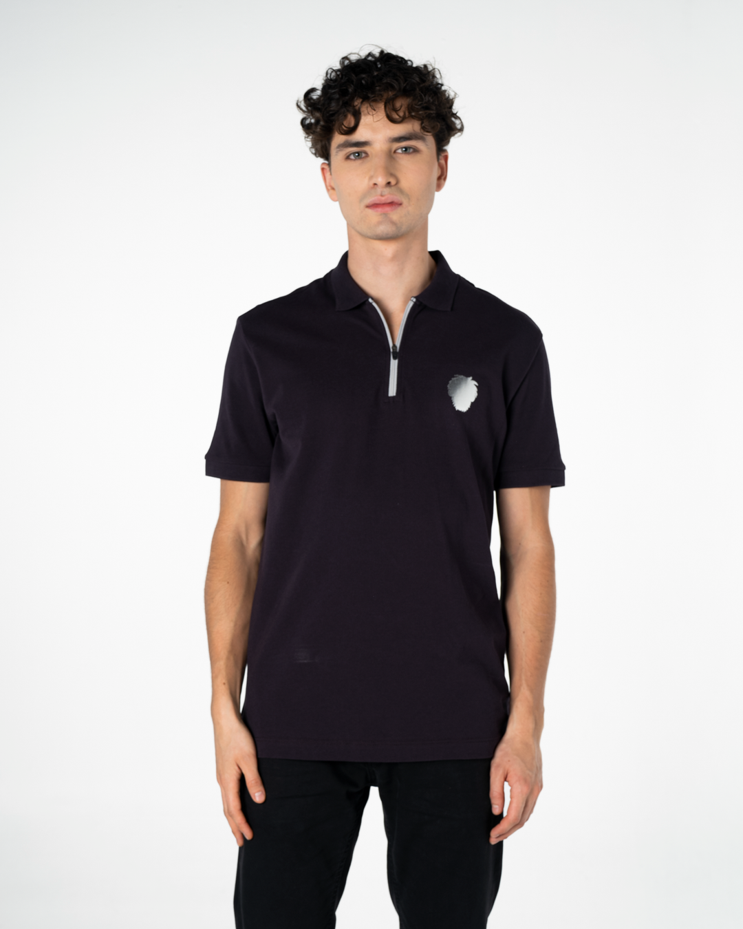 Man wearing a purple polo shirt with a small logo on a white background #color_lead