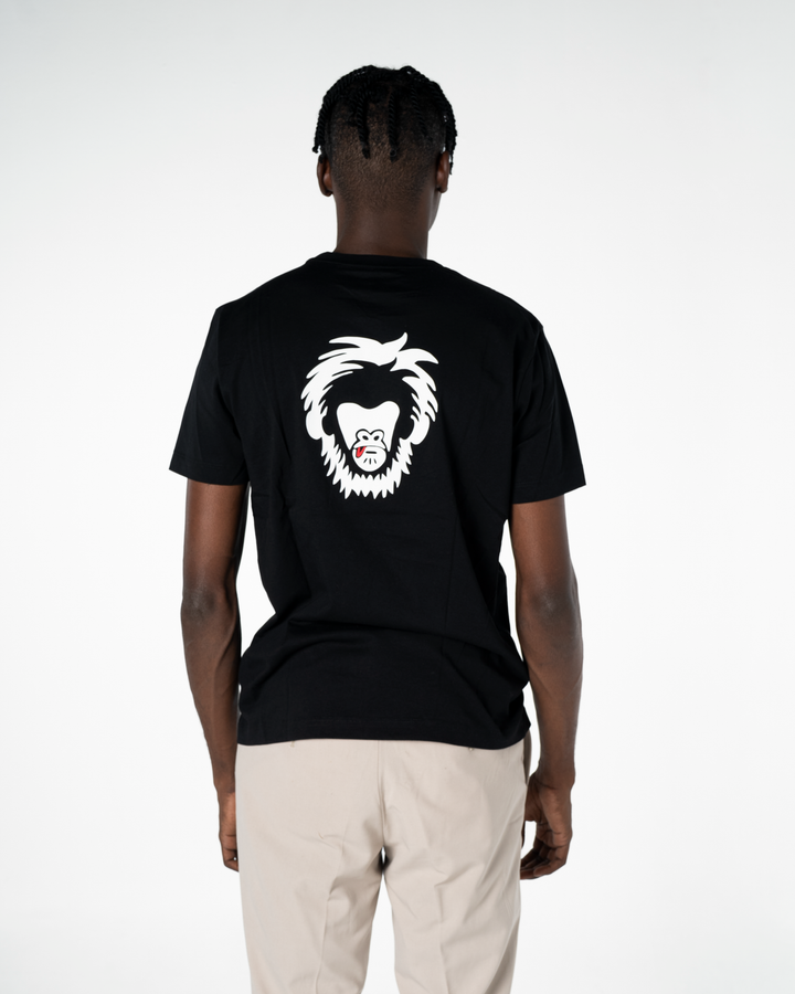 Person wearing a black t-shirt with a white graphic on the back against a white background #color_black