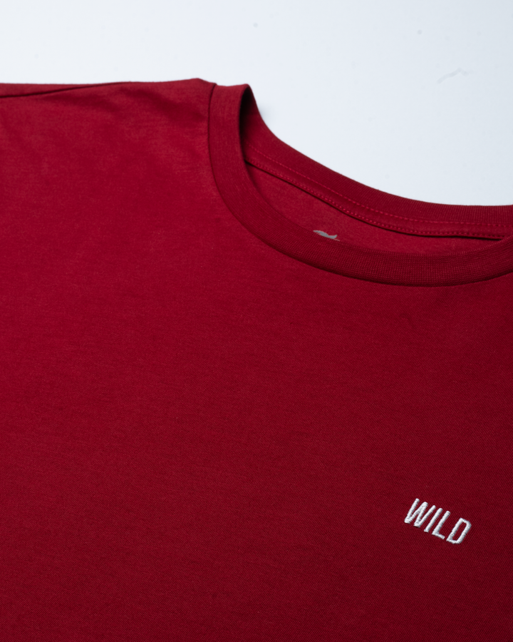Red t-shirt with 'WILD' logo on a white background #color_brick