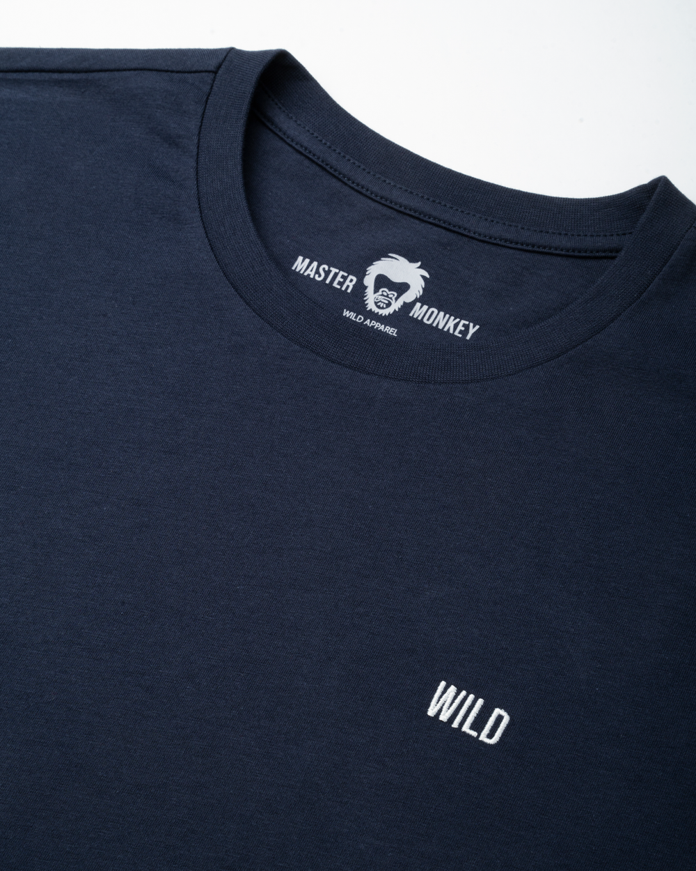 Navy blue t-shirt with 'Master Monkey' logo and 'WILD' text on a white background #color_midnight