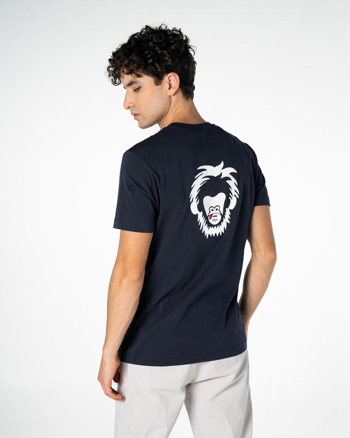 Man wearing a navy blue t-shirt with a white graphic on the back against a white background #color_midnight