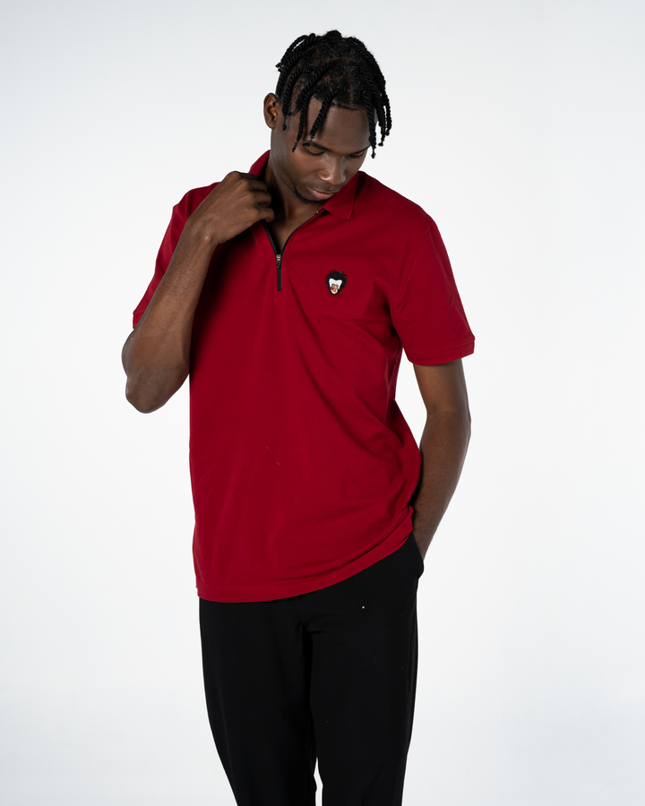 red colored polo with a black zipper, Master Monkey logo in the wearer's left chest #color_brick