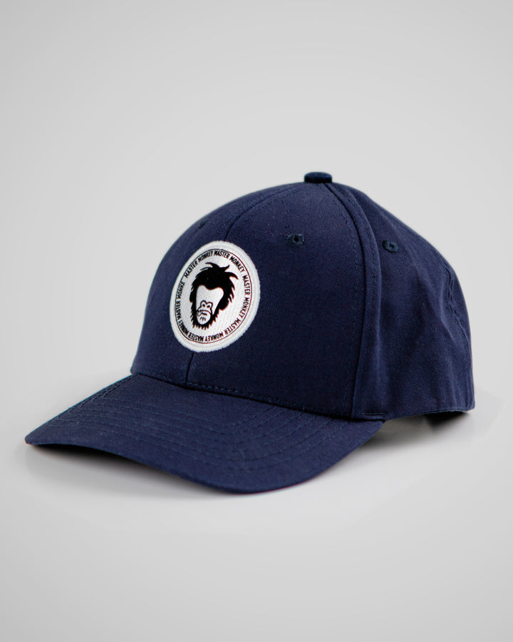 Navy blue cap with a circular logo on a light gray background #color_midnight